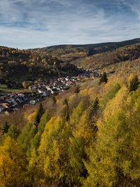 High angle view of trees and buildings against sky