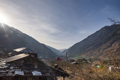 Layer of mountain peaks with nice sunset sky at a valley