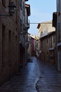 Narrow alley amidst buildings in town