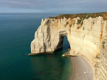 Scenic view of sea and cliff in Étretat 