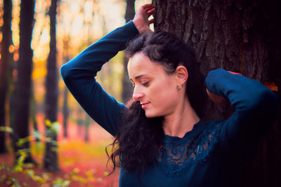 Portrait of young woman in park