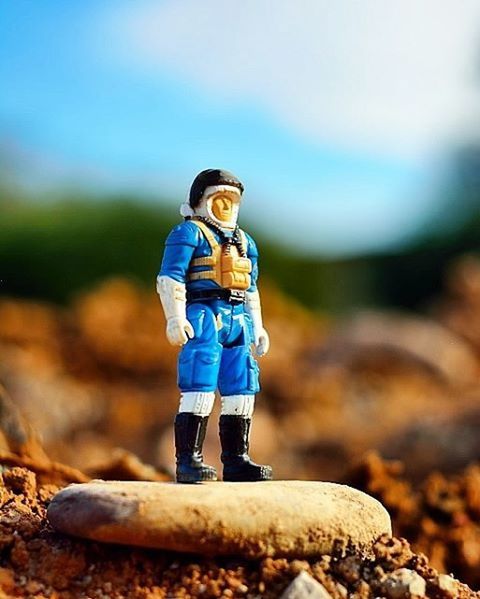 focus on foreground, rock - object, blue, nature, stone - object, balance, full length, selective focus, day, sky, tranquility, rock, outdoors, beauty in nature, stone, beach, close-up, childhood