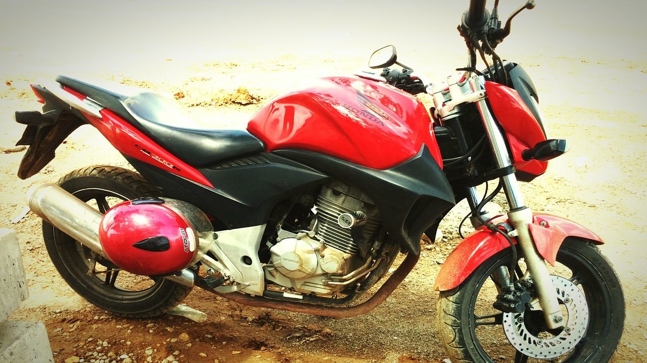 transportation, land vehicle, mode of transport, stationary, bicycle, parked, parking, red, wheel, car, high angle view, motorcycle, abandoned, no people, day, travel, outdoors, damaged, street, obsolete