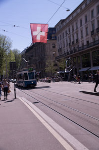 Street amidst buildings in city against sky