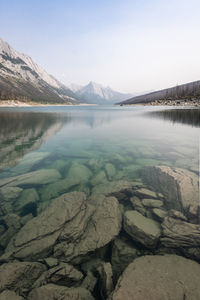 View on pristine alpine lake with clear water and mountain on its end, vertical, jasper np, canada