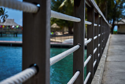 Close-up of railing on pier