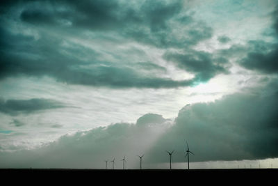 Low angle view of wind turbine against sky