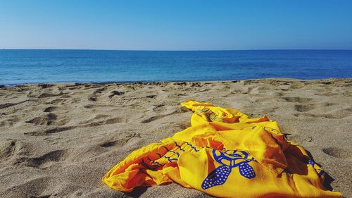 Scenic view of beach against clear sky