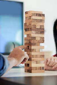 Close-up of man playing with stack