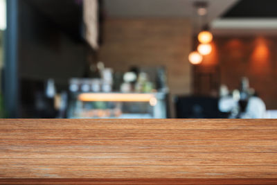 Close-up of wooden table in restaurant