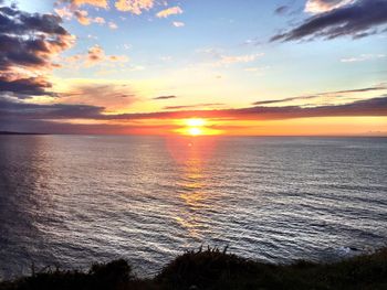 Scenic view of sea at sunset