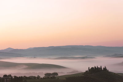 Sunrise with fog over a valley in tuscany - italy ii