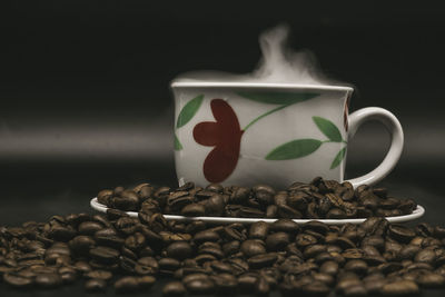 Close-up of coffee cup on table