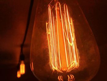 Close-up of illuminated light bulb