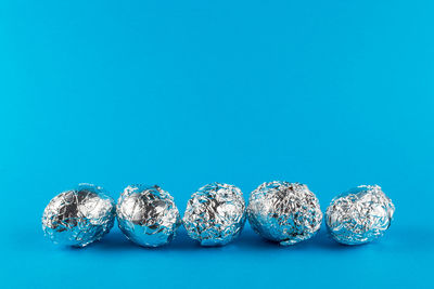 Close-up of candies against blue background