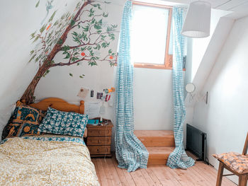 An attic room with a mural