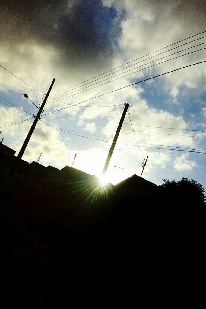 sunlight, sky, low angle view, cloud - sky, lens flare, sun, sunbeam, no people, silhouette, outdoors, day, sunset, nature