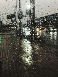 Raindrops on glass window of rainy season