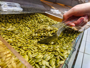 High angle view of hand holding vegetables at market