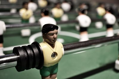 Close-up of figurine on foosball