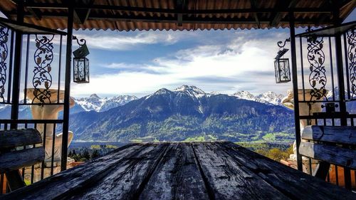 Snowcapped mountain seen from roofed structure