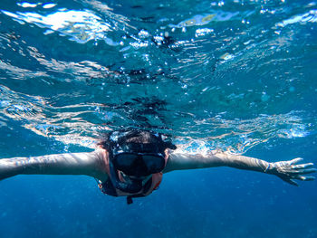 Man swimming in sea