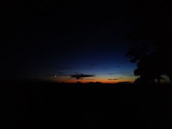 Scenic view of silhouette landscape against sky at sunset