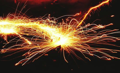 Close-up of firework display at night