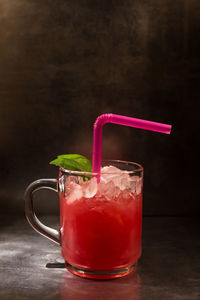 Close-up of red drink on table