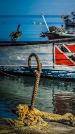 Fishing boat moored at harbor