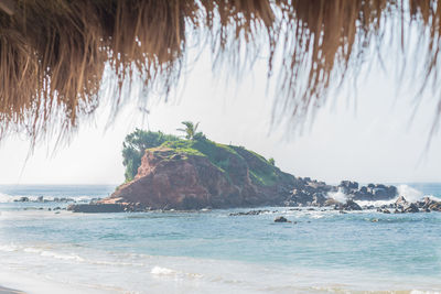 Scenic view of beach and sea against sky