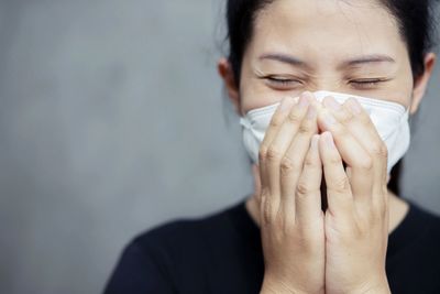 Young woman with protective face mask