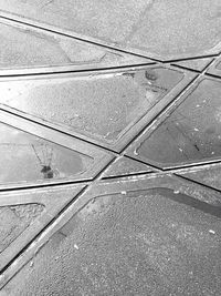 High angle view of power lines on road