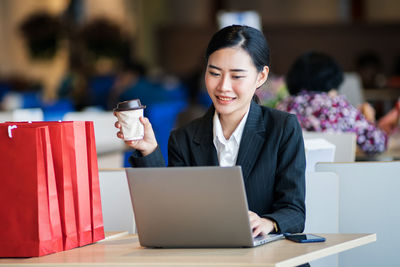 Young woman using smart phone