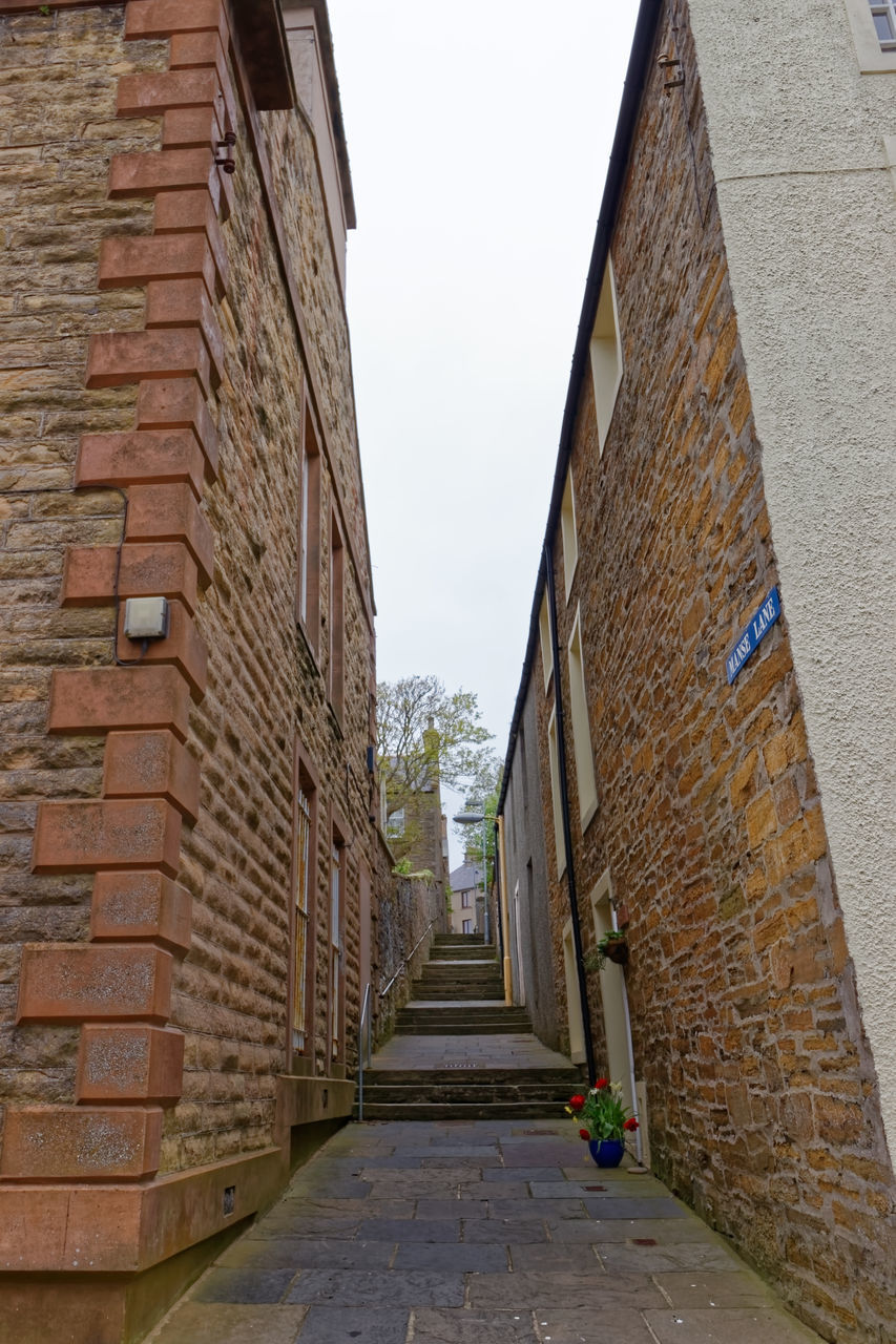 NARROW ALLEY AMIDST BUILDINGS