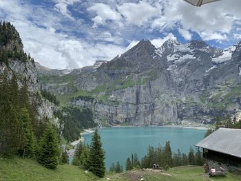 Scenic view of lake and mountains against sky