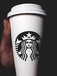 Close-up of hand holding drink