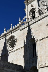 Low angle view of bell tower against clear sky