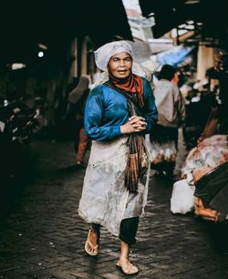 Full length of woman standing on street