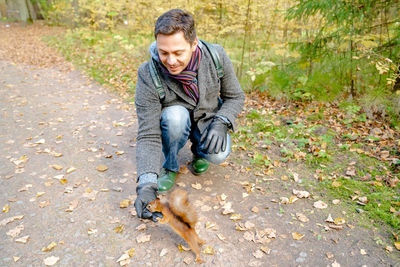 Full length of a man with dog