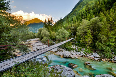 Scenic view of mountains and trees against sky