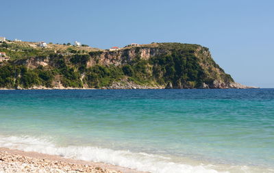 Scenic view of sea against clear blue sky