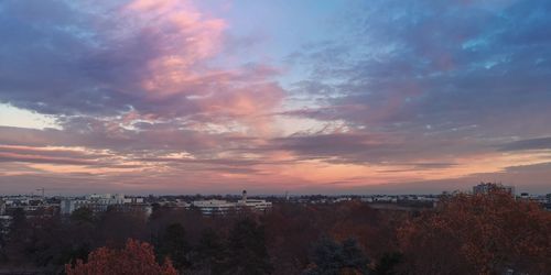Aerial view of townscape against sky at sunset