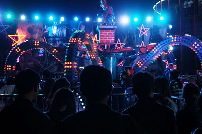 Crowd enjoying at amusement park