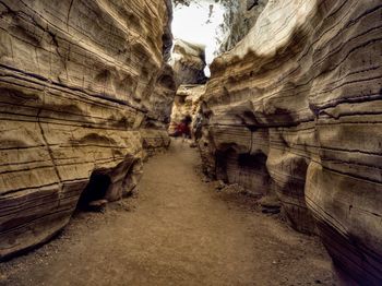 People walking on rock