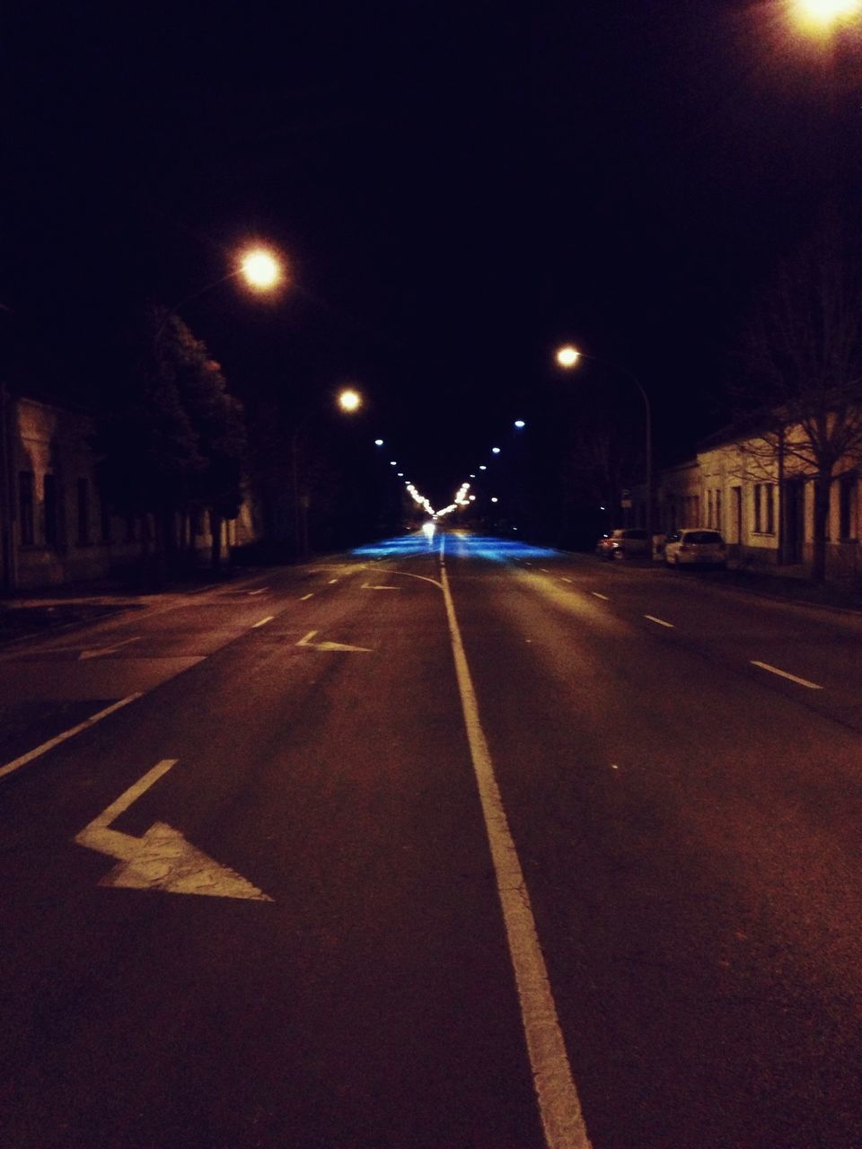 night, illuminated, transportation, road, the way forward, road marking, street light, street, diminishing perspective, lighting equipment, asphalt, vanishing point, car, empty, light trail, empty road, city, road sign, outdoors, city street