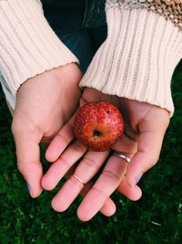 Close-up of woman holding apple