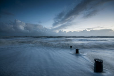 Long exposure view of sea against cloudy sky