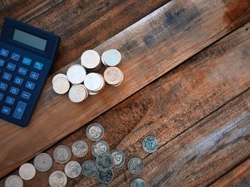 High angle view of coins on table