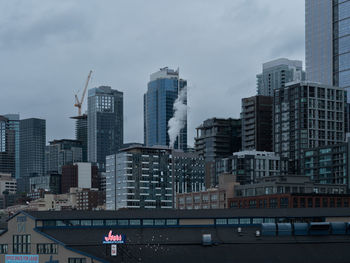 Buildings in city against sky